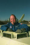Tom Jones gets familiar with an M113 armored personnel carrier during countdown rehearsals near Launch Pad 39A, Kennedy Space Center. The astronauts practice emergency escape procedures, including driving this armored vehicle, to prepare for possible launch pad emergencies and quick exit from the space shuttle.